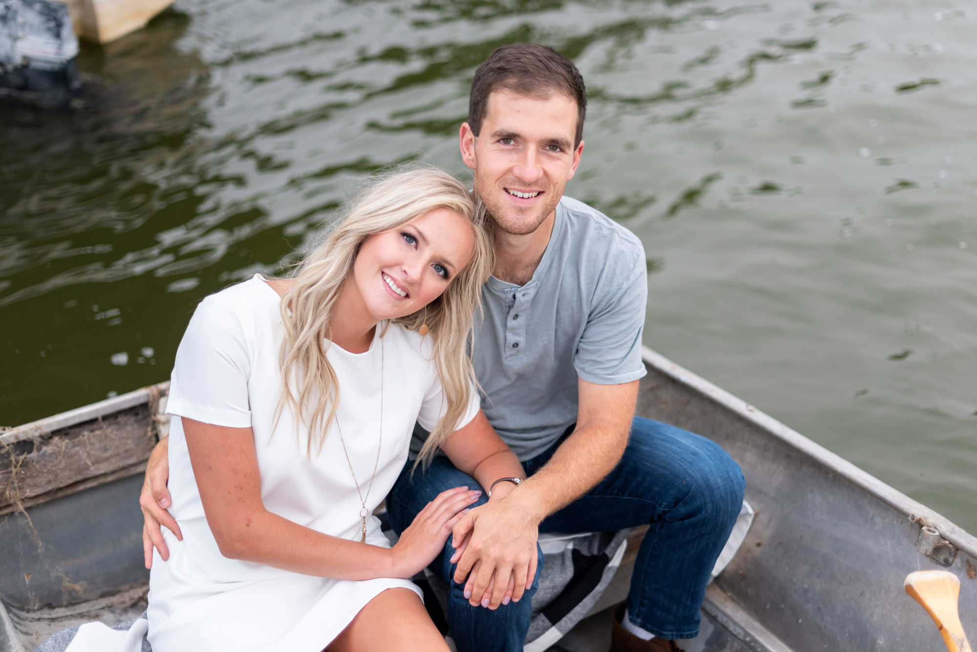 Engagement pictures in a canoe photographed by Layne Pfliiger - lake engagement - canoe engagement - lake photoshoot - lake engagement shoot - canoe